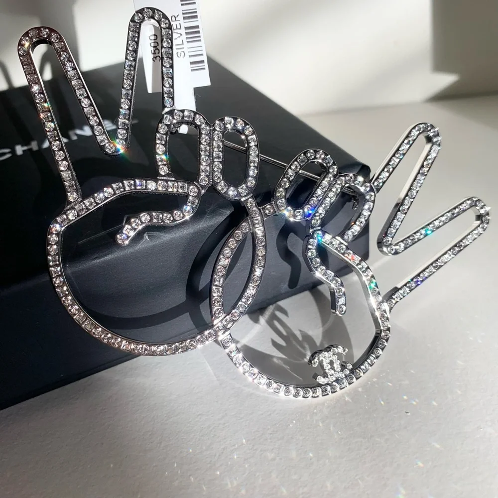 Chanel large peace hands pin